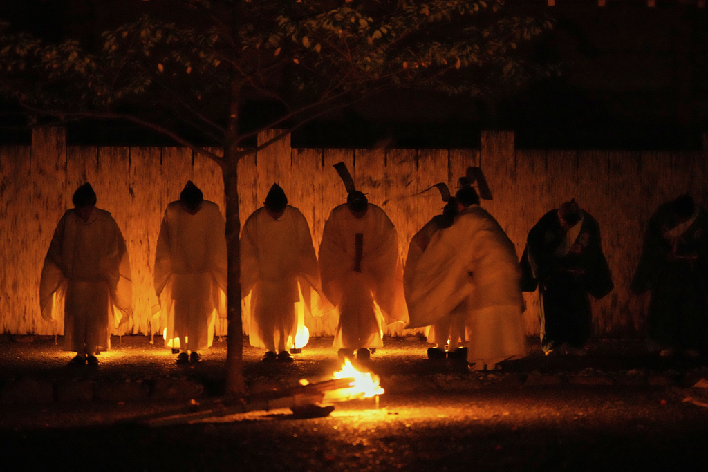 Shinto priests participate in Konomotosai, a night ceremony of the Shikinen Sengu ritual, which concludes in 2033, at the Ise Jingu shrine complex in Ise, central Japan, Friday, May 2, 2025. (AP Photo/Hiro Komae)