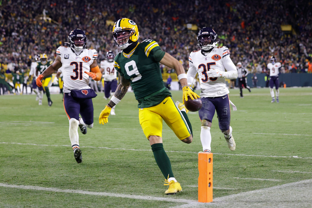 Green Bay Packers wide receiver Christian Watson (9) runs for a touchdown against the Chicago Bears during the second half of an NFL football game Sunday, Dec. 7, 2025, in Green Bay, Wis. (AP Photo/Matt Ludtke)