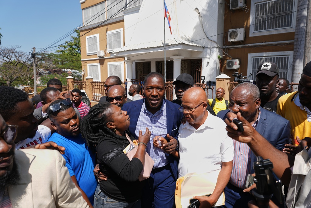 Former deputy Abel Decollines leaves after registering his political party, CAHDOA (Collective of Actors for Development and Alternative Organization), at the Provisional Electoral Council in the Petion-Ville neighborhood of Port-au-Prince, Haiti, Thursday, March 12, 2026. (AP Photo/Odelyn Joseph)