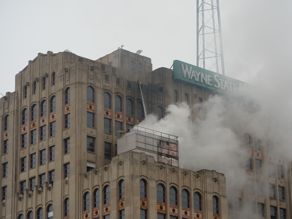 CORRECTS BYLINE TO JOHN GROVER, NOT COREY WILLIAMS - In this photo provided by the Detroit Fire Department, firefighters work to extinguish a fire at the Maccabees Building on the Wayne State University campus in Detroit on Wednesday, April 1, 2026. (John Grover/Detroit Fire Department via AP)
