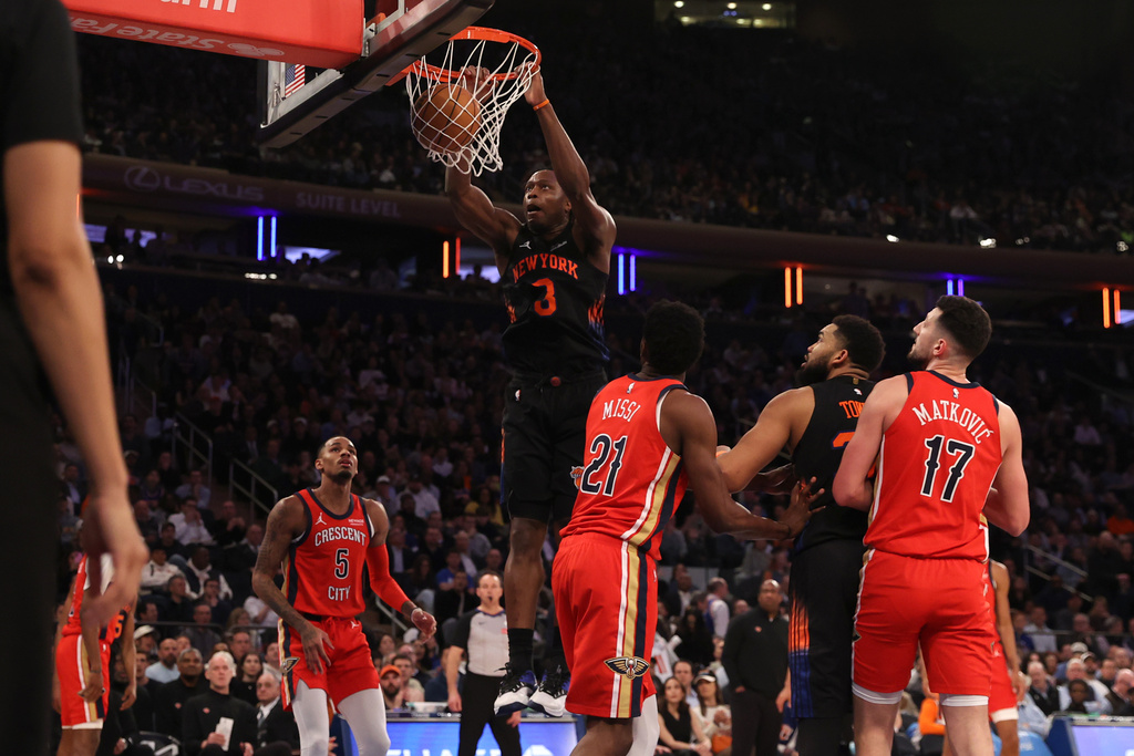New York Knicks OG Anunoby (8) dunks the ball during the first half of an NBA basketball game against the New Orleans Pelicans, Tuesday, March 24, 2026, in New York. (AP Photo/Pamela Smith)