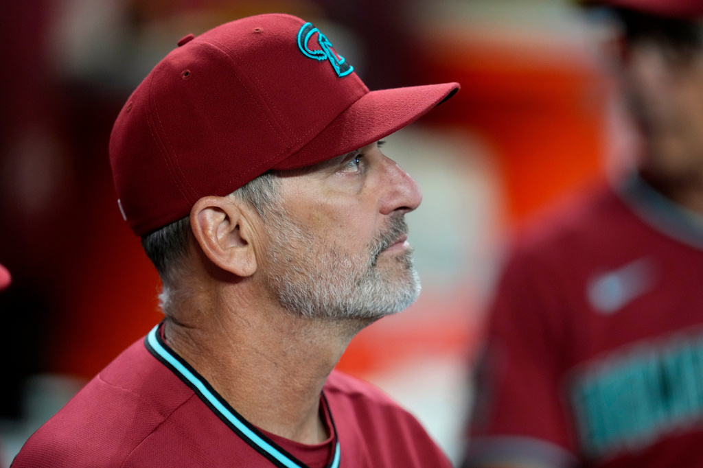 Arizona Diamondbacks manager Torey Lovullo pauses in the team dugout prior to a baseball game against the Toronto Blue Jays, Sunday, April 19, 2026, in Phoenix. (AP Photo/Ross D. Franklin)