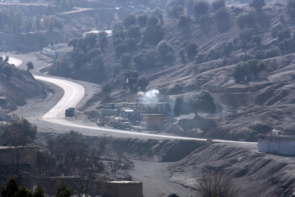 Smoke rises after an explosion at a border post on the Afghan side of the Ghulam Khan crossing with Pakistan in Khost province, Afghanistan, Friday, Feb. 27, 2026. (AP Photo/Saifullah Zahir)