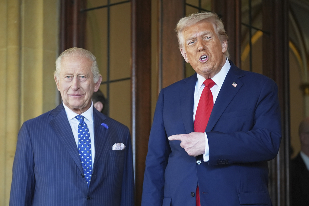 President Donald Trump gestures next to Britain's King Charles III before leaving Windsor Castle, Windsor, England, Thursday, Sept. 18, 2025. (AP Photo/Evan Vucci)