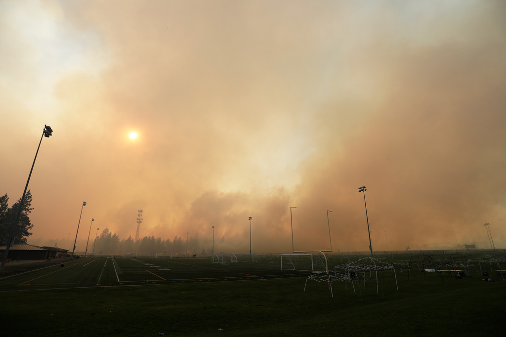 Old Trails Fire is seen from Dwight Merkel Sports Complex, Saturday, Aug. 1, 2026, in Spokane, Wash. (AP Photo/Young Kwak)