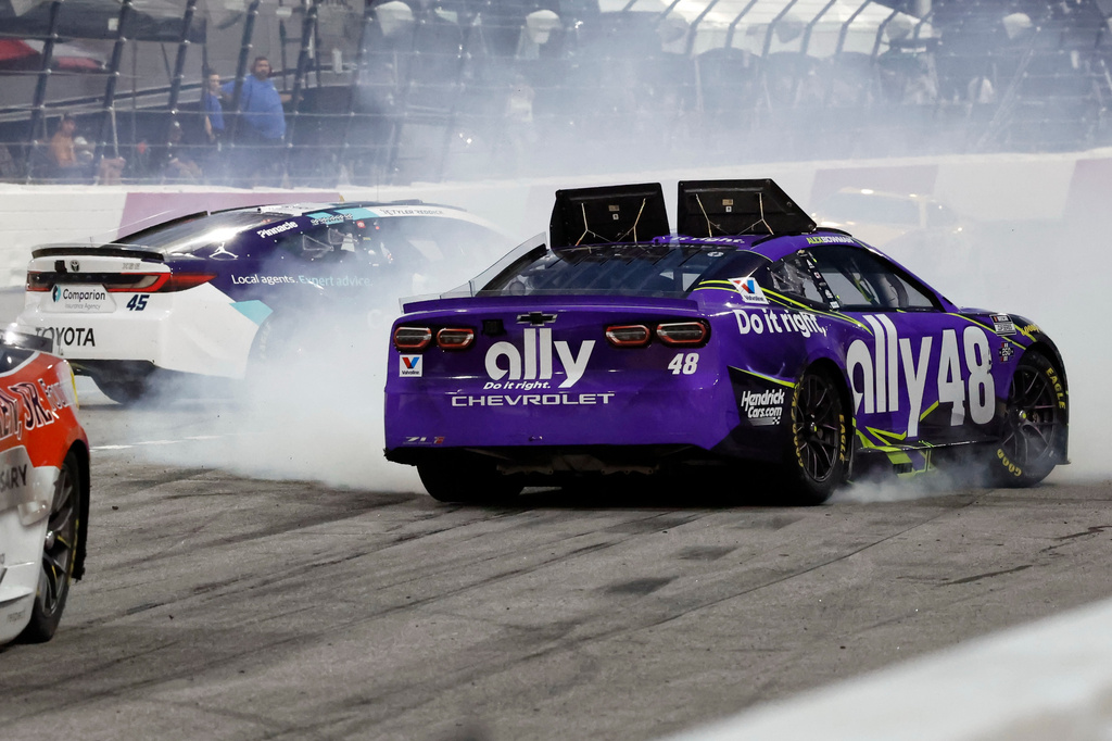 Alex Bowman (48) and Tyler Reddick (45) spin in Turn 2 during a NASCAR Cup Series auto race in North Wilkesboro, N.C., Sunday, July 19, 2026. (AP Photo/Terry Renna)