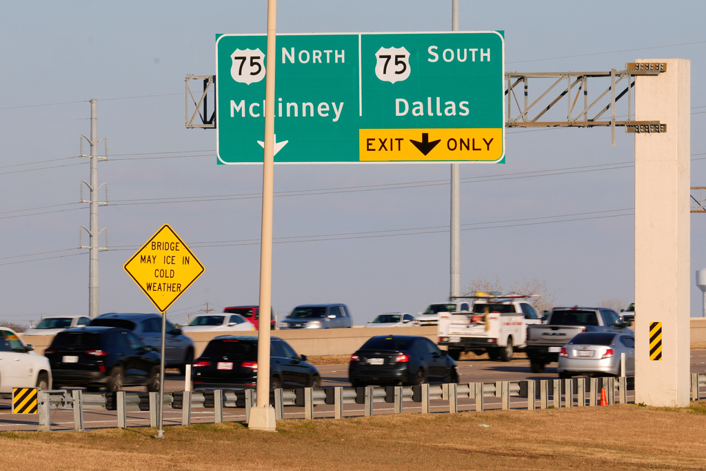 A road sign warns of possible icy road conditions on the President George Bush turnpike Wednesday, Jan. 21, 2026. (AP Photo/Tony Gutierrez)
