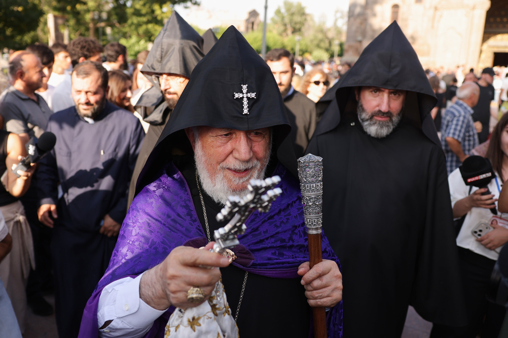 The head of the Armenian Apostolic Church Catholicos Karekin II, front, blesses people in Vagharshapat, Armenia, Friday, Aug. 7, 2026. (AP Photo/Anthony Pizzoferrato)