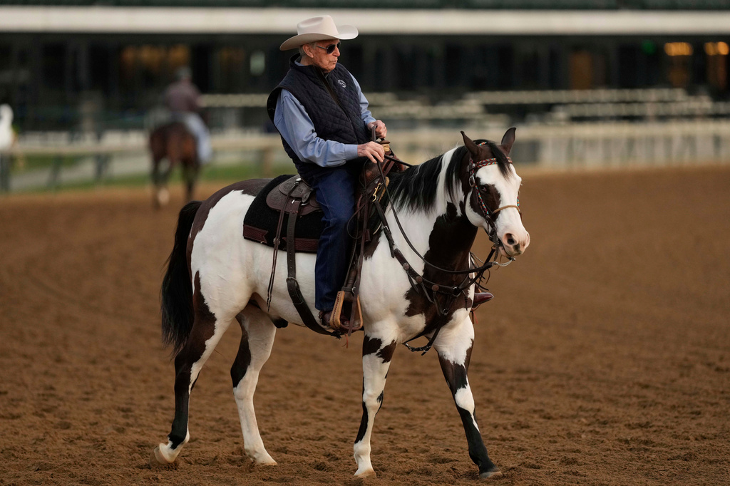 FILE - Trainer D. Wayne Lukas watches a workout at Churchill Downs Thursday, May 1, 2025, in Louisville, Ky. (AP Photo/Charlie Riedel, File)