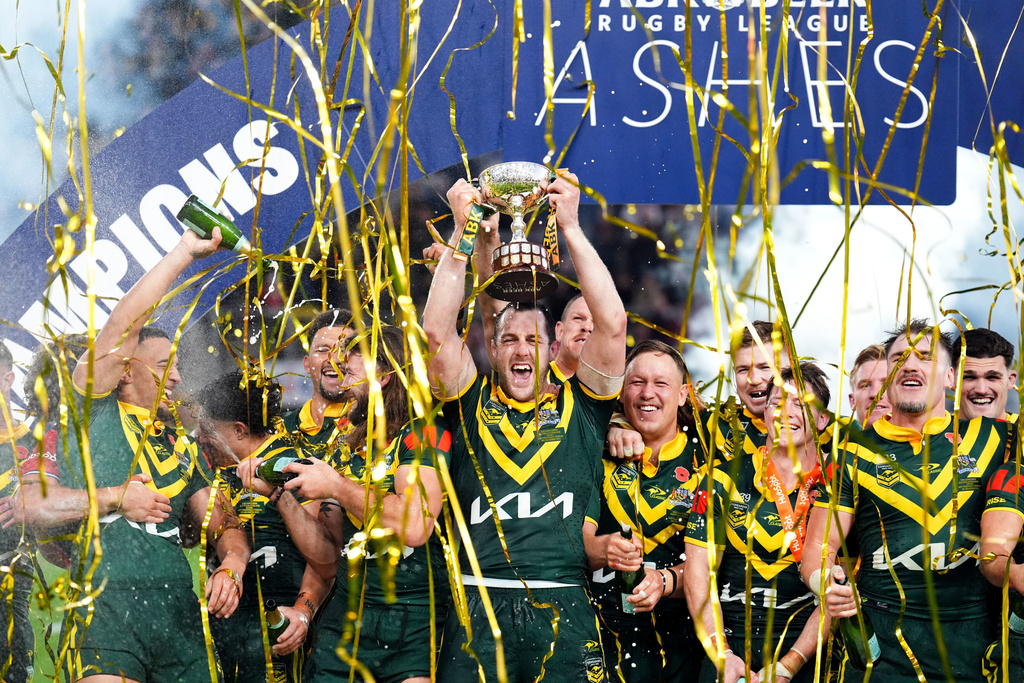 Australia's Isaah Yeo and team mates celebrate with the trophy following a 3-0 series win over England following the rugby League Ashes series match between England and Australia, in Leeds, England, Saturday Nov. 8, 2025. (Mike Egerton/PA via AP)