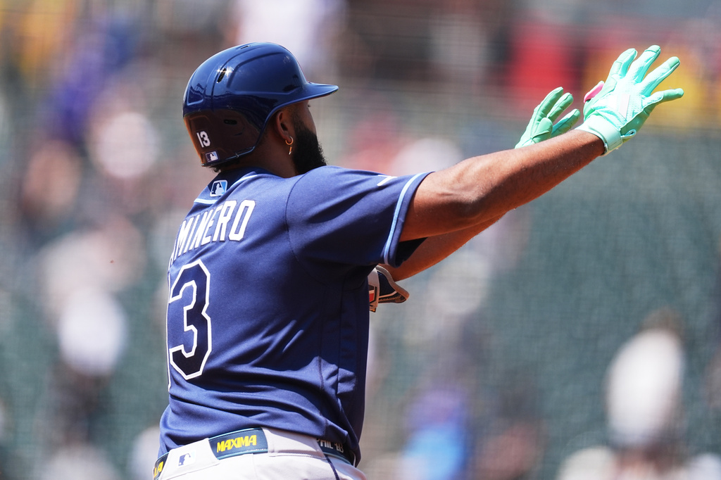 Tampa Bay Rays' Junior Caminero gestures to the bullpen as he circles the bases after hitting a solo home run off Colorado Rockies starting pitcher Tomoyuki Sugano in the third inning of a baseball game in Denver, Wednesday, Aug. 5, 2026. (AP Photo/David Zalubowski)