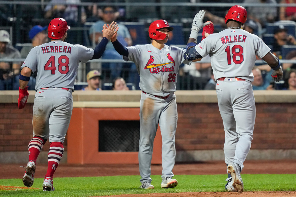 St. Louis Cardinals designated hitter Jordan Walker (18) celebrates with JJ Wetherholt (26), and Iván Herrera (48) after hitting a three run home run during the fourth inning of a baseball game against the New York Mets, Wednesday, June 10, 2026, in New York. (AP Photo/Yuki Iwamura)