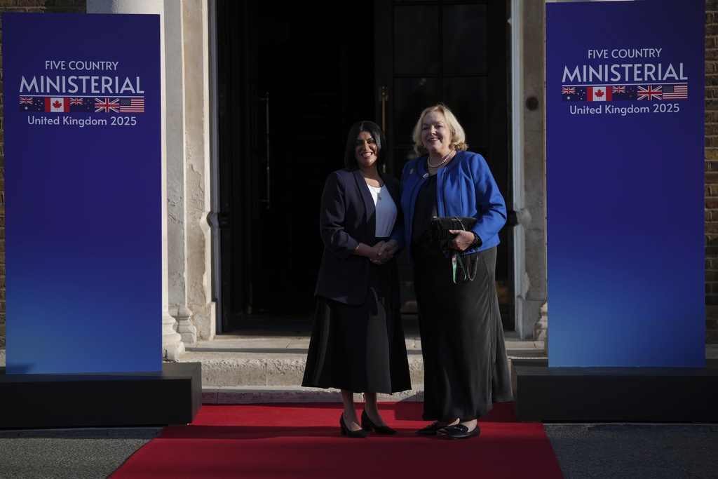 Britain's Home Secretary Shabana Mahmood, left, greets New Zealand's Minister Judith Collins prior to the Five Country Ministerial meeting at the Honourable Artillery Company in London, Monday, Sept. 8, 2025 as interior ministers of the UK, US, Canada, Australia and New Zealand will discuss some of the major security threats facing our nations. (AP Photo/Kin Cheung)
