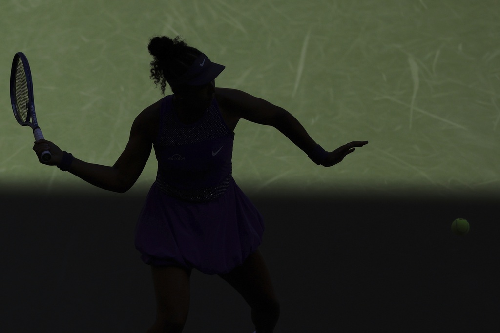 Naomi Osaka, of Japan, returns a shot against Daria Kasatkina, of Australia, during the third round of the U.S. Open tennis championships, Saturday, Aug. 30, 2025, in New York. (AP Photo/Heather Khalifa)