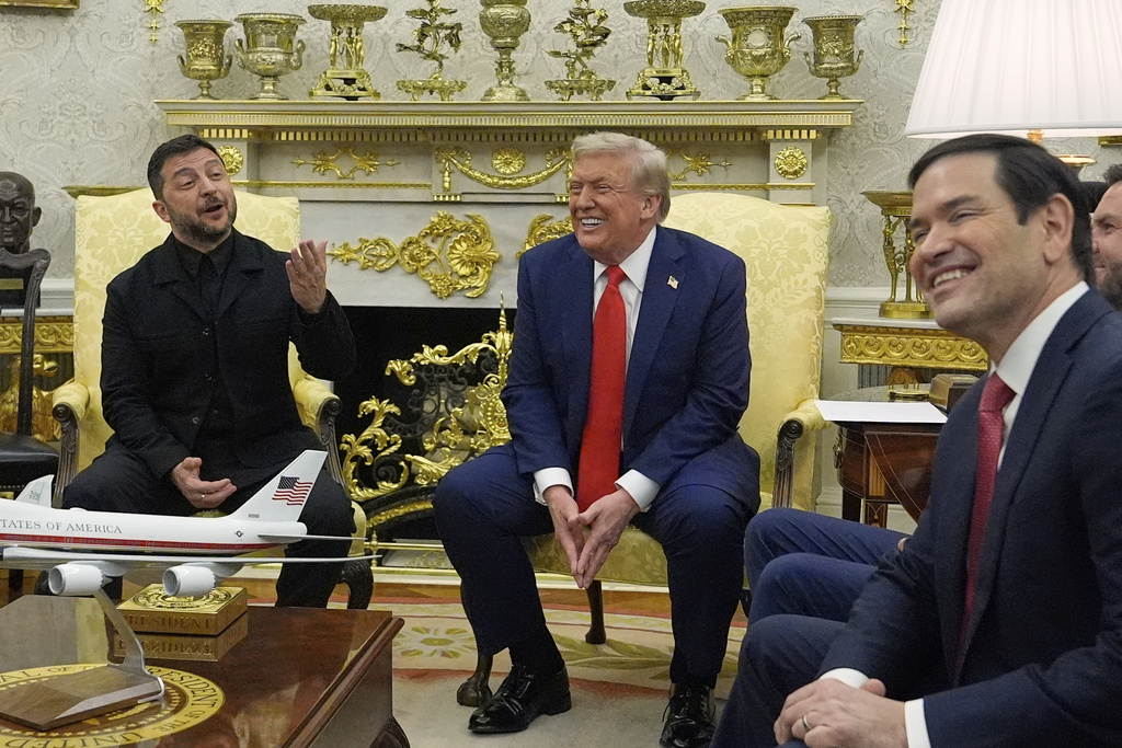 President Donald Trump meets with Ukraine's President Volodymyr Zelenskyy in the Oval Office at the White House, Monday, Aug. 18, 2025, in Washington, as Secretary of State Marco Rubio smiles at right. (AP Photo/Julia Demaree Nikhinson)
