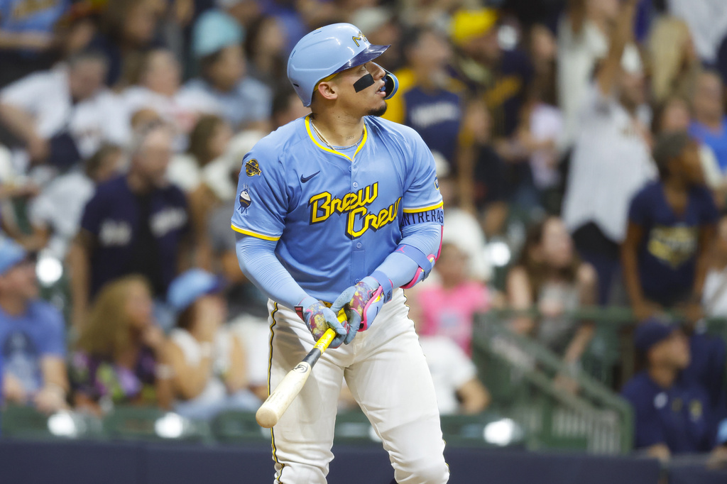Milwaukee Brewers' William Contreras watches his winning home run during the ninth inning of a baseball game against the San Francisco Giants, Friday, Aug. 22, 2025, in Milwaukee. (AP Photo/Jeffrey Phelps)