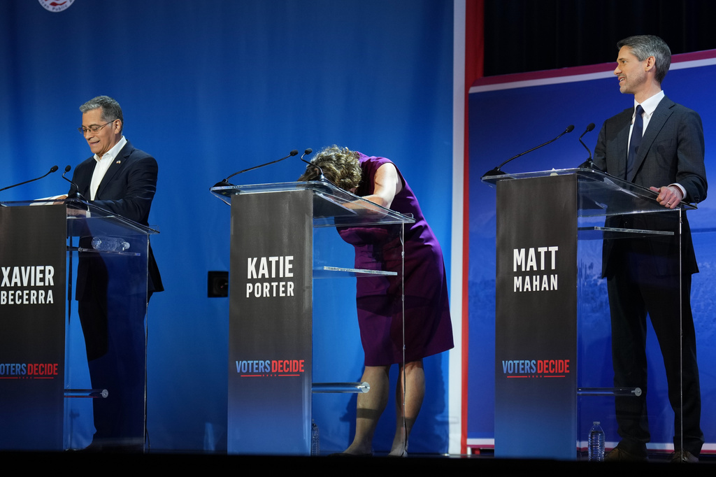 Katie Porter, center, reacts during a California gubernatorial debate hosted by CBS LA at Pomona College in Claremont, Calif., Tuesday, April 28, 2026. (AP Photo/Jae C. Hong)