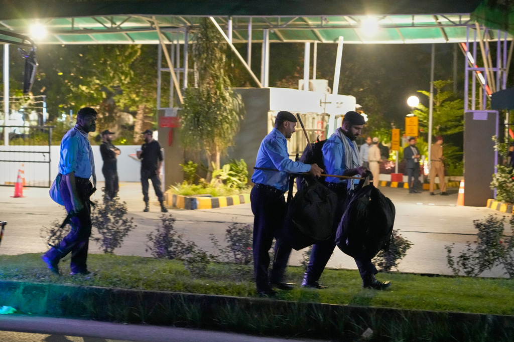 Police officers arrive to take position outside the Shifa International Hospital, where imprisoned former Prime Minister Imran Khan will be transferred for a medical examination following Pakistan's Supreme Court order, in Islamabad, Pakistan, Thursday, Aug. 20, 2026. (AP Photo/Anjum Naveed)