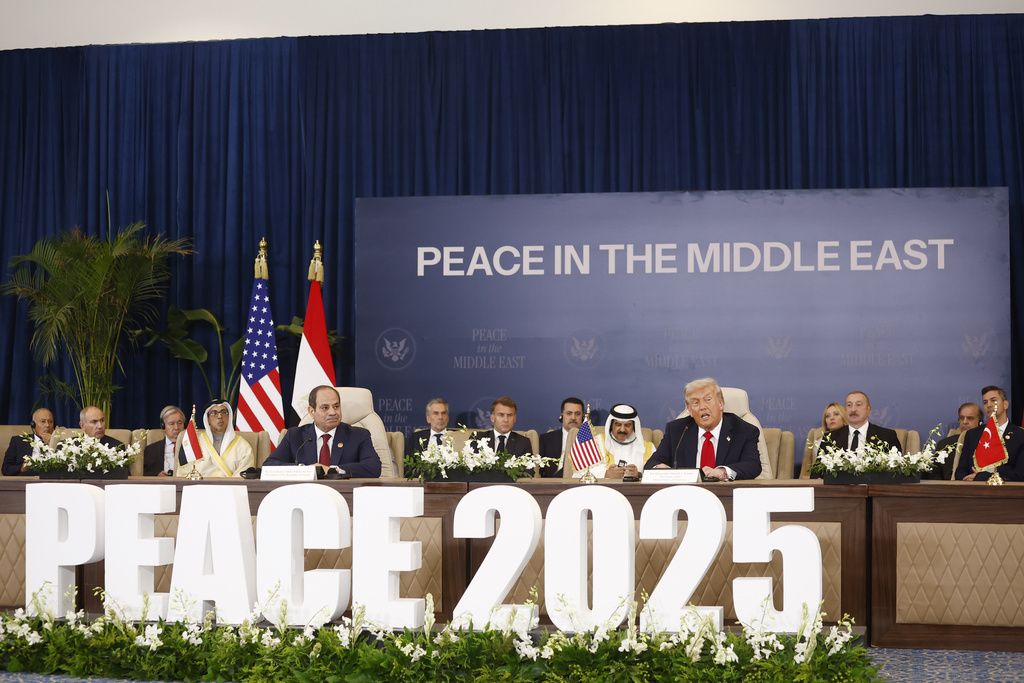President Donald Trump and Egyptian President Abdel Fattah al-Sissi, left, attend the signature ceremony at the Gaza International Peace Summit, in Sharm el-Sheikh, Egypt, Monday, Oct.13 2025. (Yoan Valat, Pool photo via AP)