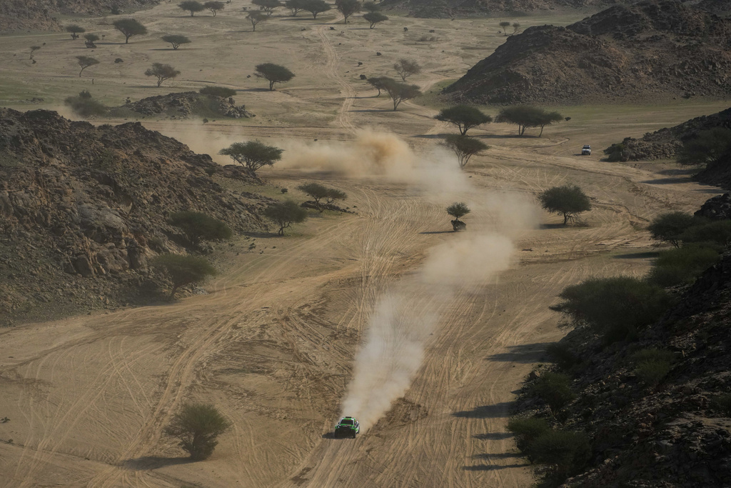 Driver Eryk Goczal and co-driver Szymon Gospodarczyk compete during the first stage of the Dakar Rally in Yanbu, Saudi Arabia, Sunday, Jan. 4, 2026. (AP Photo/Thibault Camus)