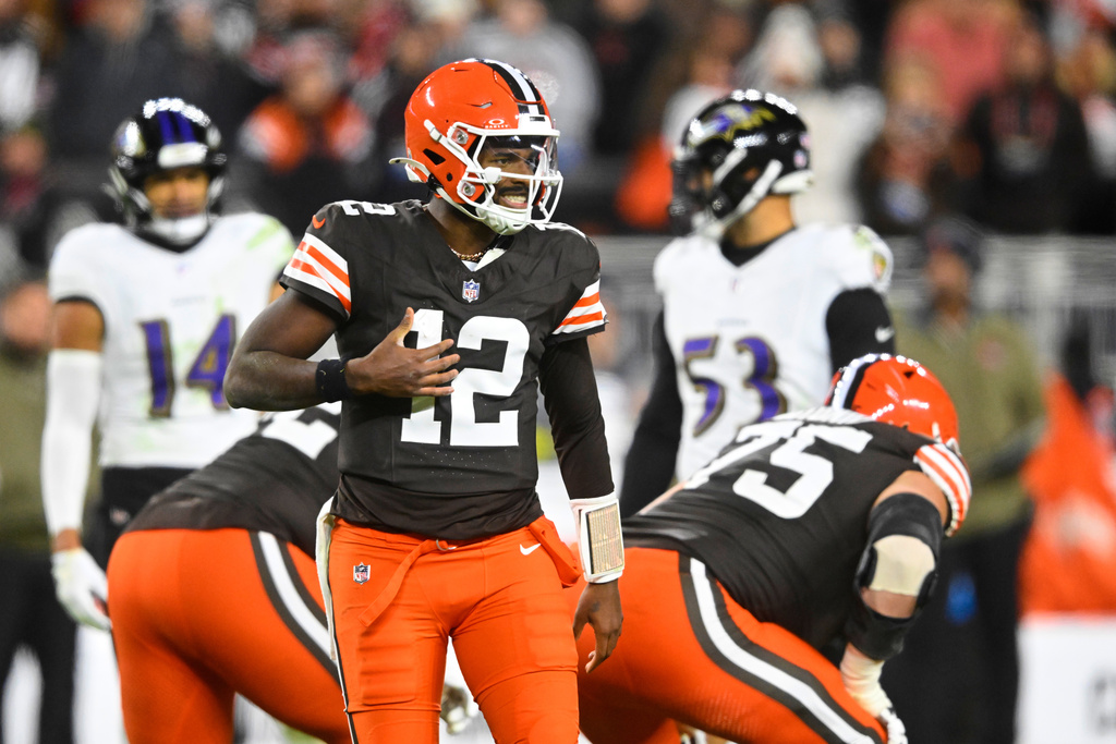 Cleveland Browns quarterback Shedeur Sanders (12) signals at the line of scrimmage in the second half of an NFL football game against the Baltimore Ravens in Cleveland, Sunday, Nov. 16, 2025. (AP Photo/David Richard)
