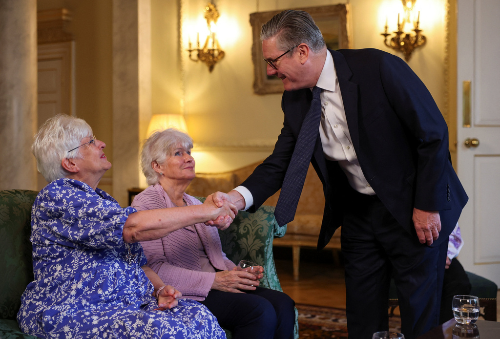 Britain's Prime Minister Keir Starmer meets with campaigners to discuss historical forced adoption, at Downing Street, in London, Thursday July 2, 2026. (Isabel Infantes/Pool Photo via AP)