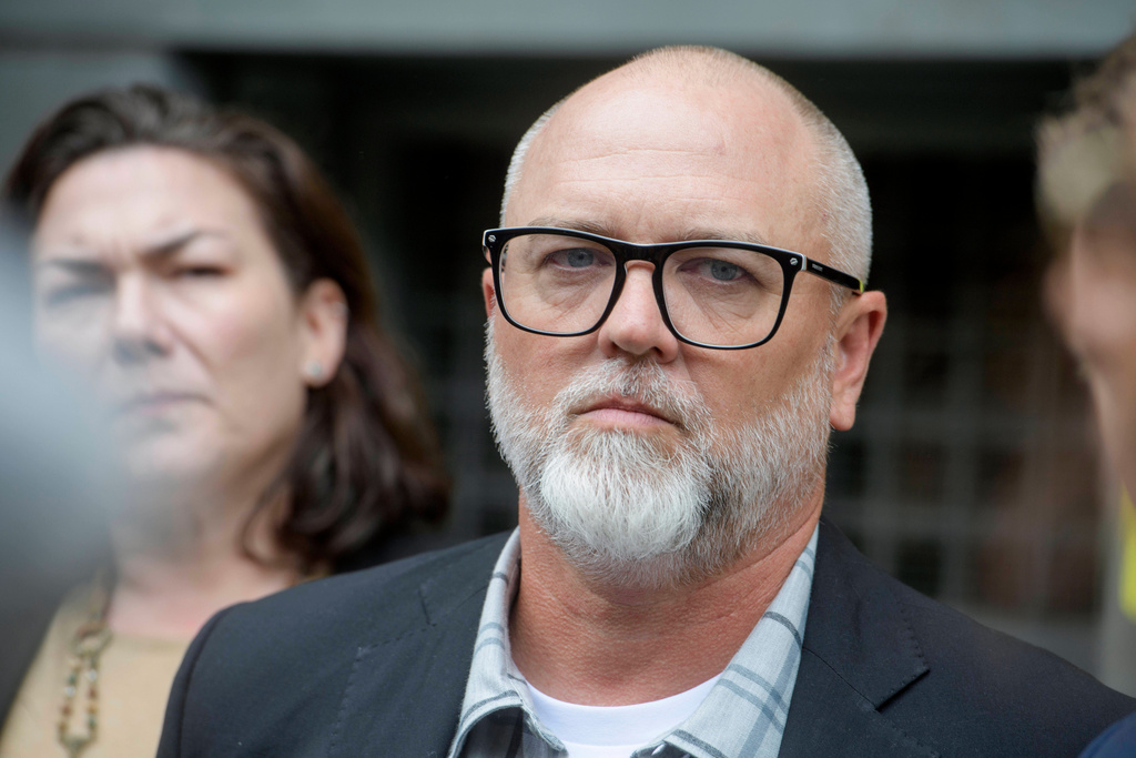 FILE - Jan Carey, a North Carolina veteran who burned a flag near the White House last month, listens while his attorneys speak following his arraignment at the E. Barrett Prettyman Federal Courthouse, Wednesday, Sept. 17, 2025, in Washington. (AP Photo/Rod Lamkey, Jr., File)