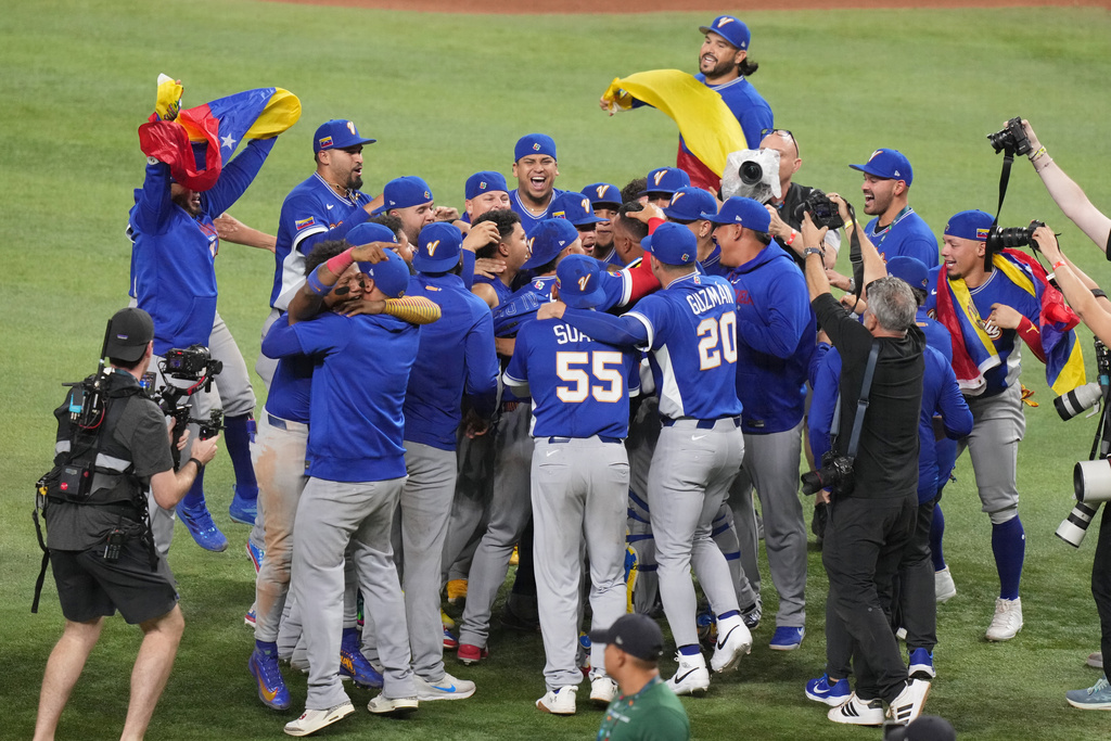 Venezuela celebrates after defeating the United States in the championship game of the World Baseball Classic, Tuesday, March 17, 2026, in Miami. (AP Photo/Lynne Sladky)