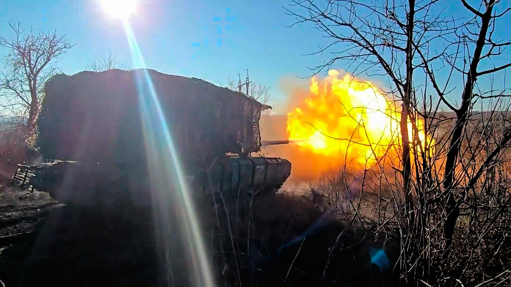 In this image made from video provided by the Russian Defense Ministry Press Service on Saturday, April 4, 2026, a Russian T-72B3M tank fires towards Ukrainian position. (Russian Defense Ministry Press Service via AP)