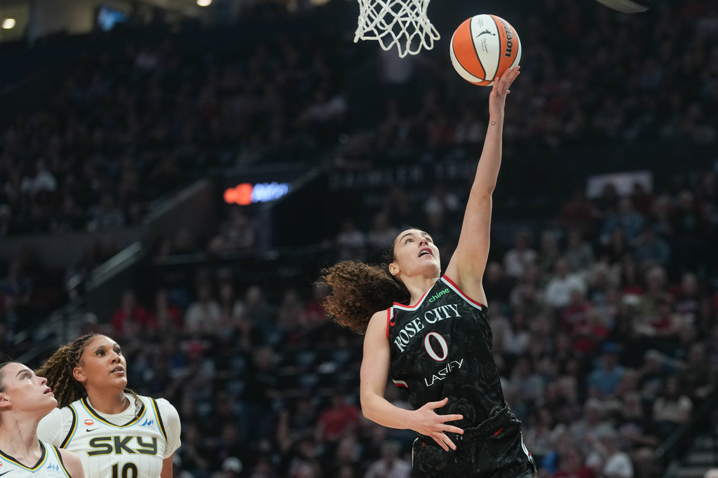 Portland Fire guard Carla Leite (0) goes to the basket during the first half of a WNBA basketball game against the Chicago Sky on Saturday, May 9, 2026, in Portland, Ore. (AP Photo/Jenny Kane)