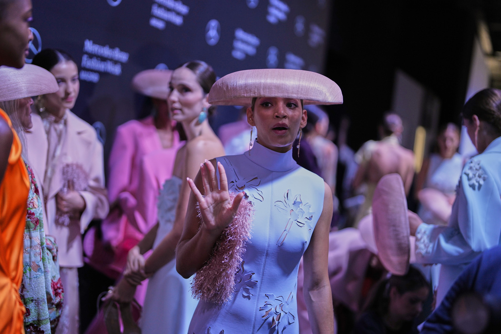Models wear designs by Isabel Sanchis backstage during the brand's show at Fashion Week in Madrid, Spain, Friday, Sept. 19, 2025. (AP Photo/Manu Fernandez)