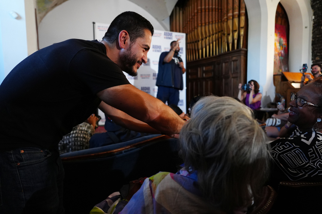 Abdul El-Sayed, a progressive candidate in the Democratic primary for U.S. Senate in Michigan, greets people at a campaign rally, Monday, Aug. 3, 2026, in Detroit. (AP Photo/Julia Demaree Nikhinson)