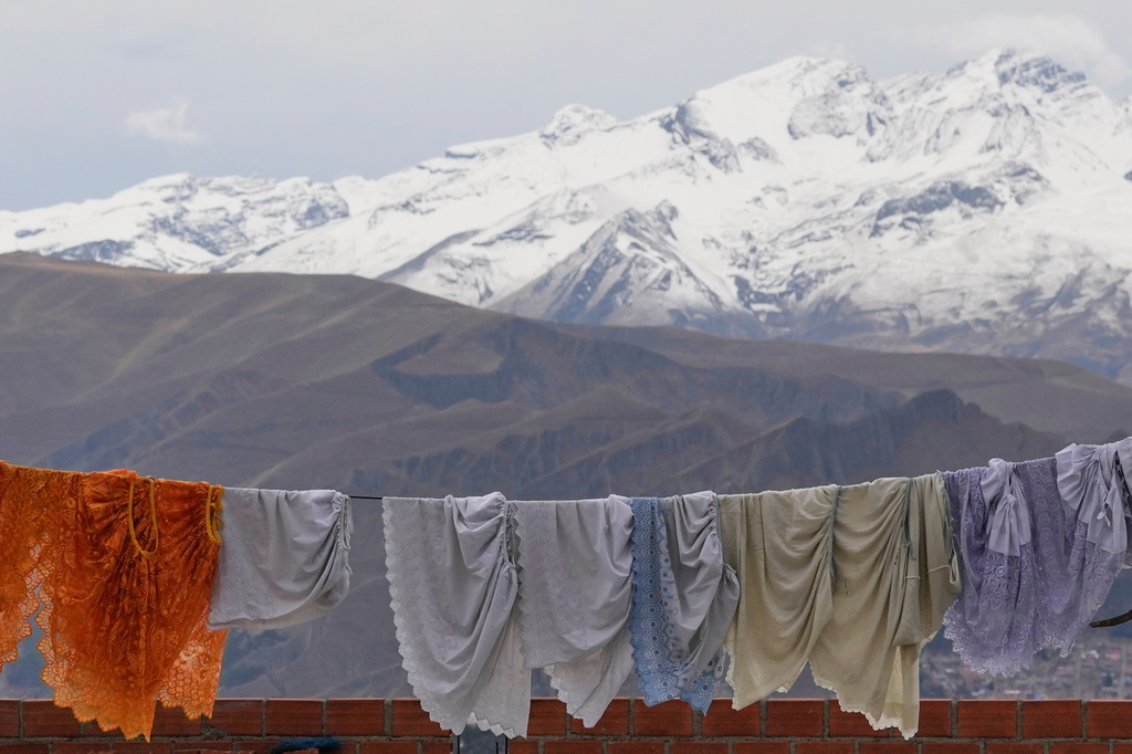Skirts hang drying in El Alto, Bolivia, Monday, Oct. 13, 2025. (AP Photo/Juan Karita)