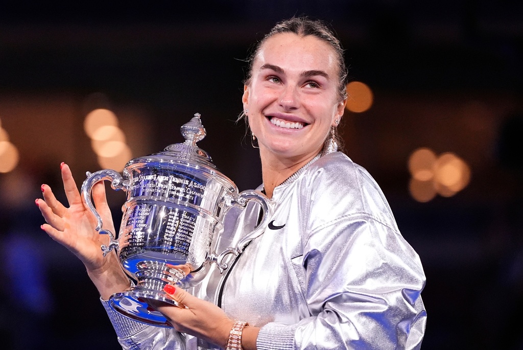 FILE - Aryna Sabalenka, of Belarus, holds her trophy aftyer defeating Amanda Anisimova, of the United States, after the women's finals of the U.S. Open tennis championships, Saturday, Sept. 6, 2025, in New York. (AP Photo/Yuki Iwamura, File)