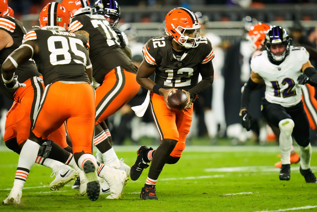 Cleveland Browns quarterback Shedeur Sanders (12) drops back from the line of srimmage during the second half of an NFL football game against the Baltimore Ravens in Cleveland, Sunday, Nov. 16, 2025. (AP Photo/Sue Ogrocki)