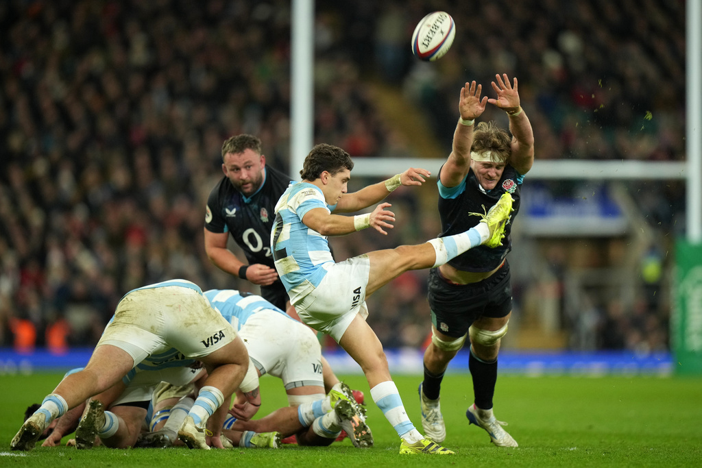 Argentina's Agustin Moyano clears from England's Alex Coles during the Nation's Series rugby union international between England and Argentina at Twickenham, London, Sunday, Nov. 23, 2025. (AP Photo/Alastair Grant)