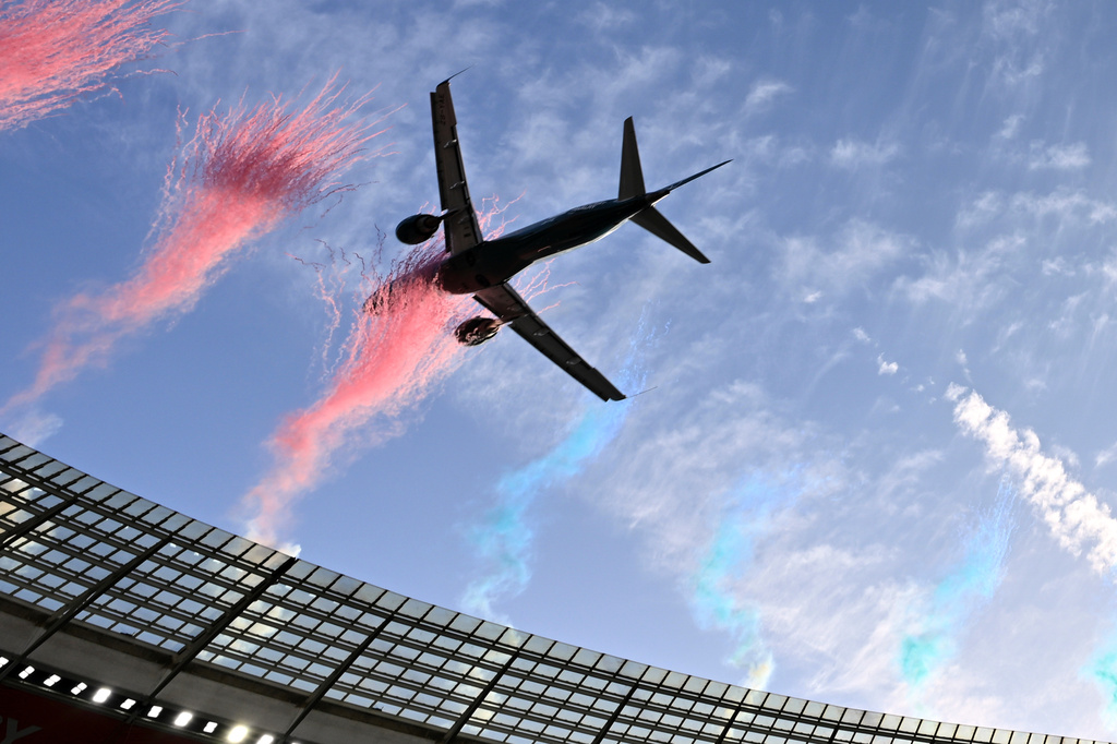 A jetliner flies over the stadium ahead of a second Test rugby match between South Africa and New Zealand, in Cape Town, South Africa, Saturday, Aug. 29, 2026. (AP Photo)