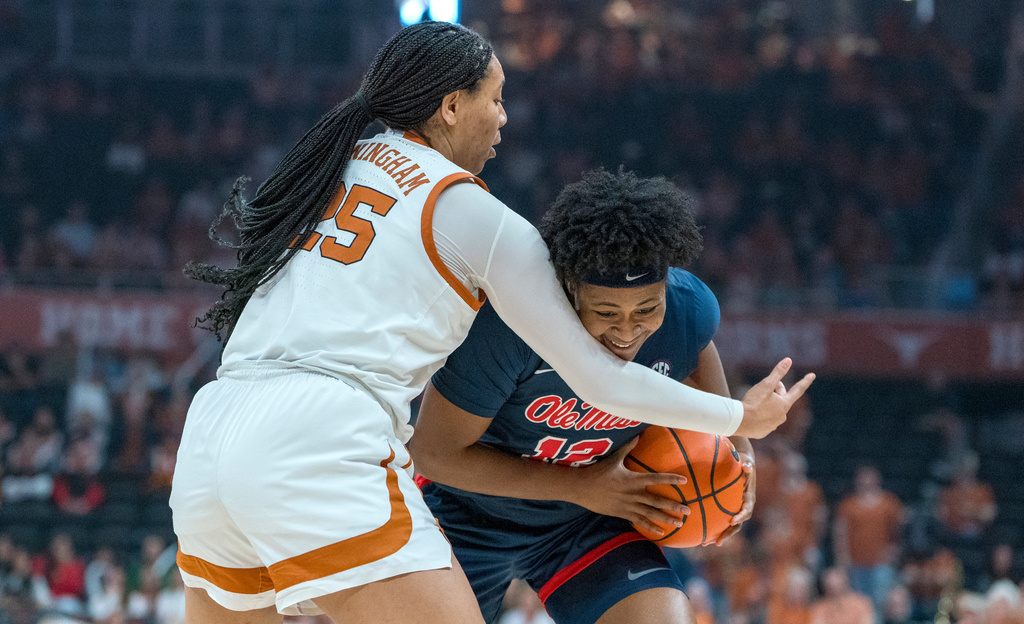 Texas forward Breya Cunningham, left, defends against Mississippi forward Christeen Iwuala, right, during the first half of an NCAA college basketball game in Austin, Texas, Sunday, Jan. 4, 2026. (AP Photo/Rodolfo Gonzalez)