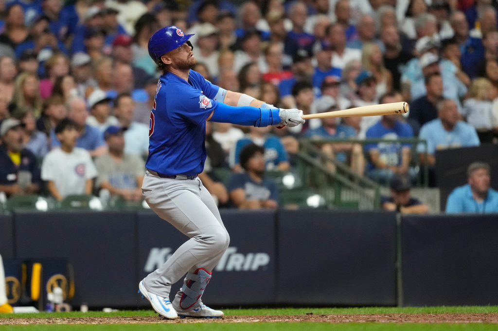 Chicago Cubs' Carson Kelly hits a go ahead two-run double during the ninth inning of a baseball game against the Milwaukee Brewers, Tuesday, Sept. 8, 2026, in Milwaukee. (AP Photo/Aaron Gash)