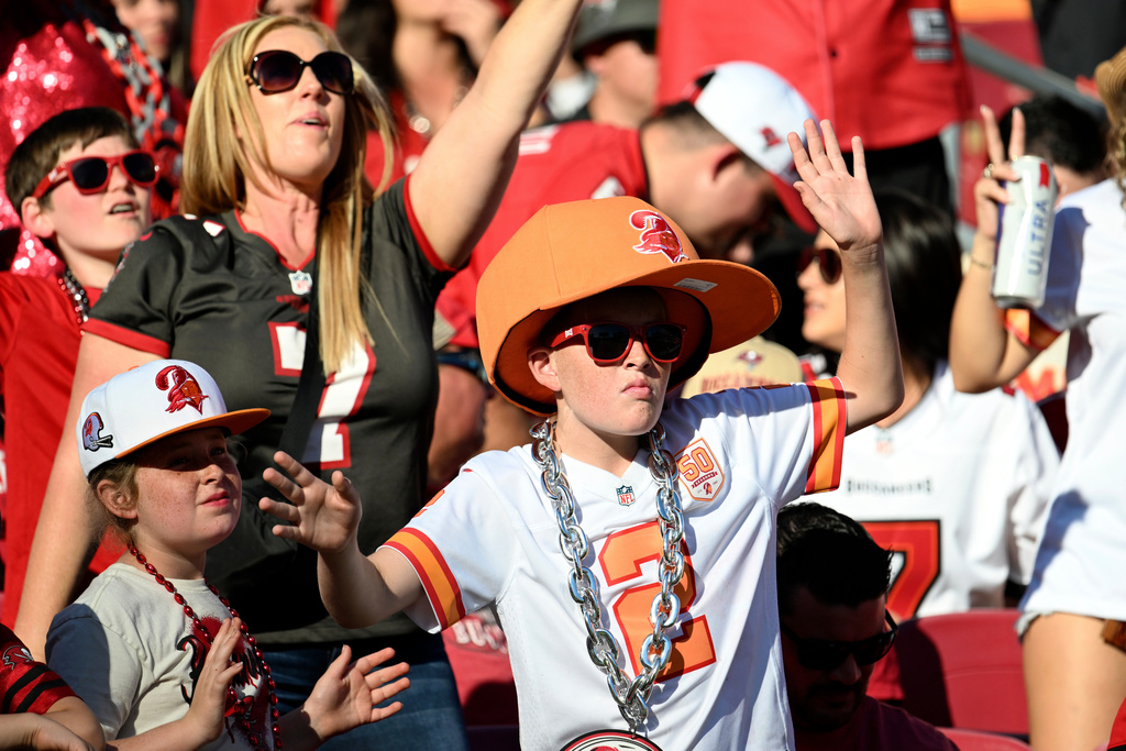 Tampa Bay Buccaneers fans cheer on their team during the second half of an NFL football game against the Arizona Cardinals Sunday, Nov. 30, 2025, in Tampa, Fla. (AP Photo/Jason Behnken)