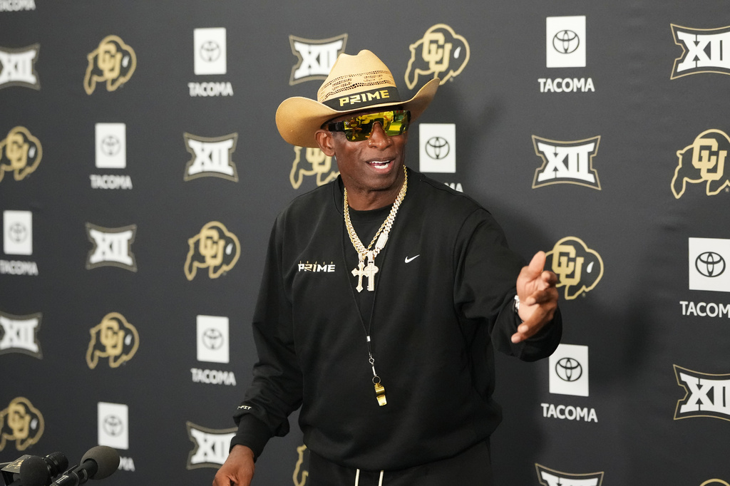 Colorado head coach Deion Sanders talks to reporters after practice at an NCAA college football training camp in Fountain, Colo., Thursday, Aug. 6, 2026. (AP Photo/David Zalubowski)