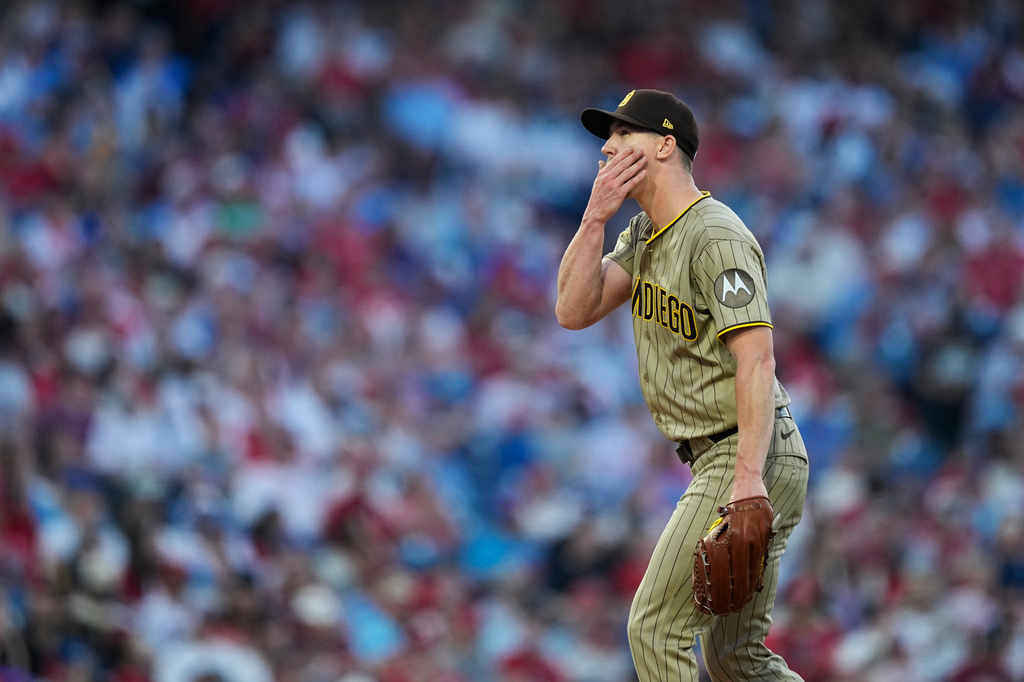 San Diego Padres' Walker Buehler wipes his face while pitching against Philadelphia Phillies' Trea Turner during the fifth inning of a baseball game Wednesday, June 3, 2026, in Philadelphia. (AP Photo/Matt Slocum)