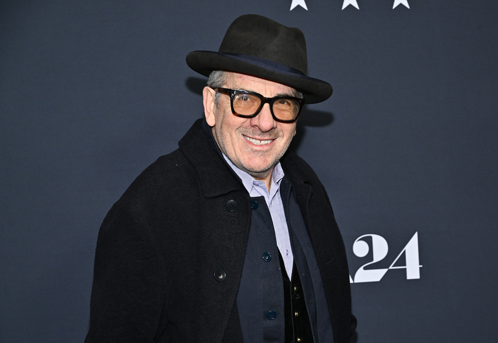 FILE - Elvis Costello attends the premiere of, "Marty Supreme," at Regal Times Square on Dec. 16, 2025, in New York. (Photo by Evan Agostini/Invision/AP, File)