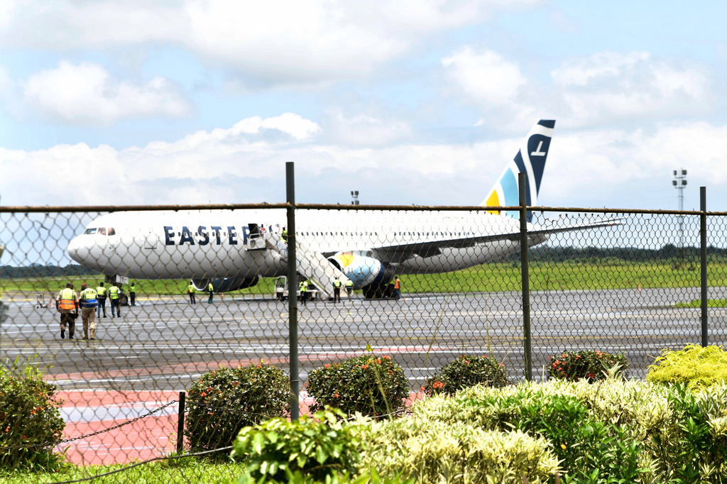 A plane carrying the deportees from the United States arrives at the Roberts International Airport outside of Monrovia, Liberia, Thursday, Aug. 20, 2026. (AP Photo/Alexander Wiaplah)