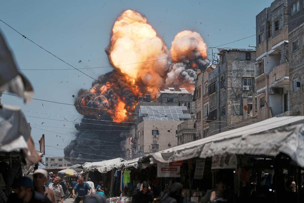 Flames and thick smoke erupt from an Israeli airstrike in Gaza City, Sunday, June 1, 2025. (AP Photo/Jehad Alshrafi)