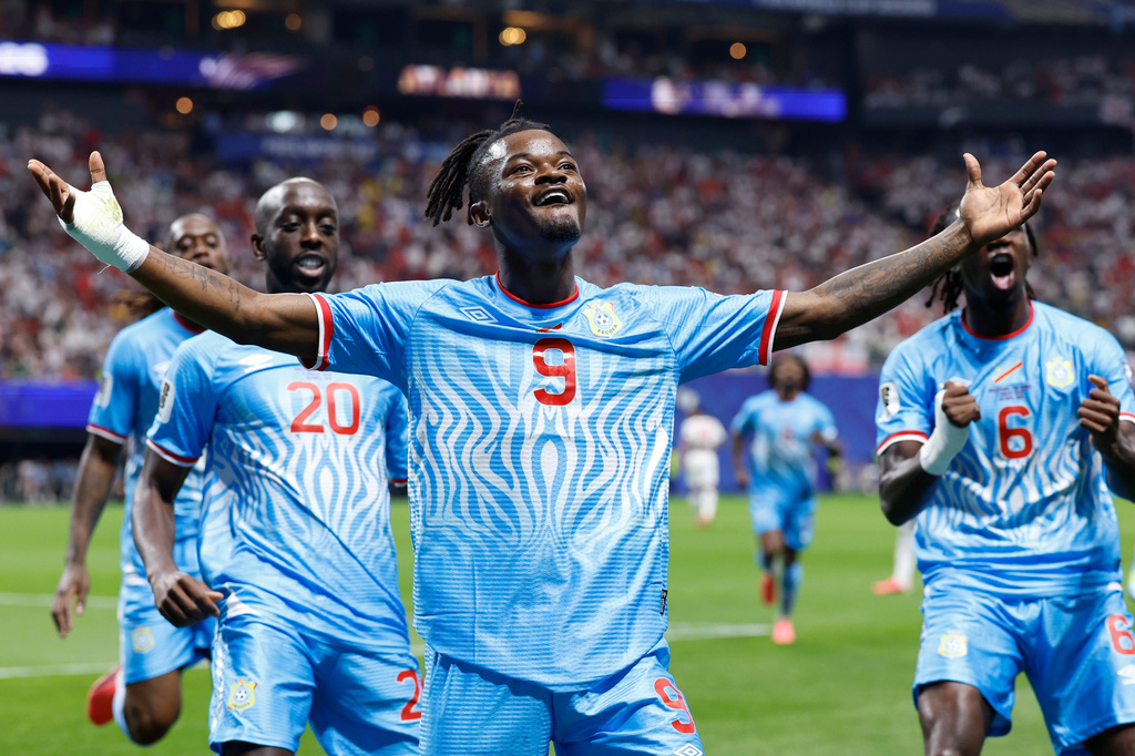 Congo's Brian Cipenga (9) celebrates with teammates after scoring their first goal during the World Cup round of 32 soccer match between England and Congo in Atlanta, Wednesday, July 1, 2026. (AP Photo/Butch Dill)