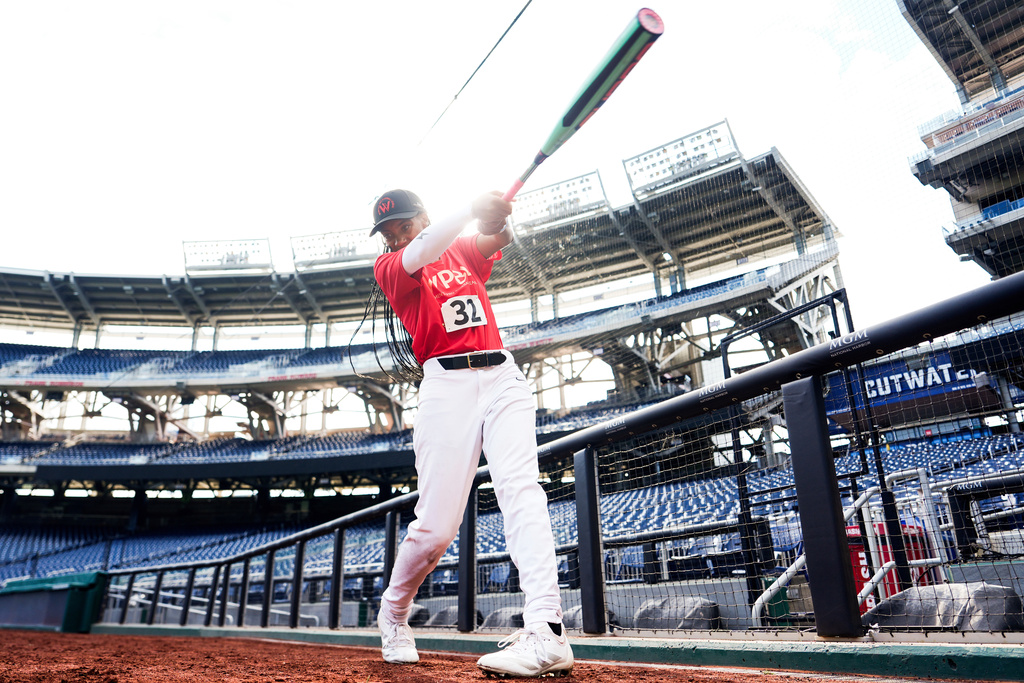 FILE - Mo'ne Davis warms up during the fourth day of tryouts for the Women's Professional Baseball League, Aug. 25, 2025, at Nationals Park in Washington. (AP Photo/Julia Demaree Nikhinson, File)