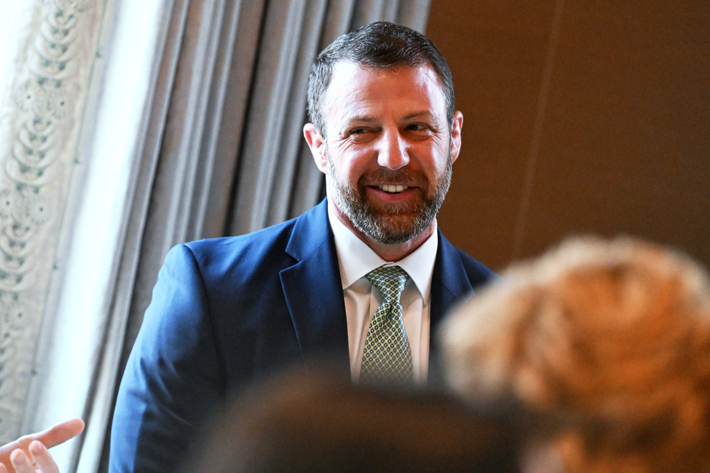 Sen. Markwayne Mullin, R-Okla., tapped by President Donald Trump to replace Homeland Security Secretary Kristi Noem, attends a St. Patrick's Day breakfast hosted by Vice President JD Vance and Second lady Usha Vance in honor of Ireland's Prime Minister Micheál Martin and his wife Mary O'Shea, at the Vice President's residence in the U.S. Naval Observatory, Tuesday, March 16, 2026 in Washington. (Roberto Schmidt/Pool via AP)