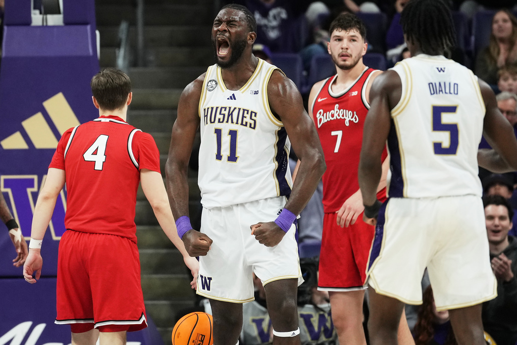 Washington center Franck Kepnang (11) reacts to a foul by Ohio State during the second half of an NCAA college basketball game Sunday, Jan. 11, 2026, in Seattle. (AP Photo/Lindsey Wasson)