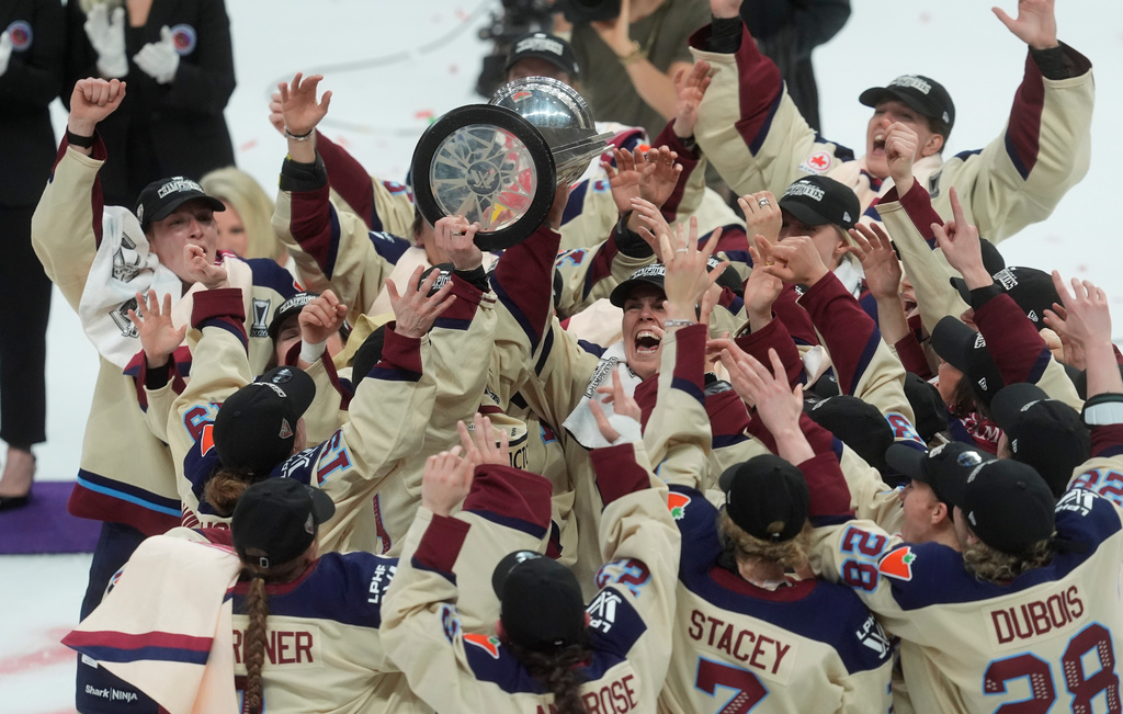 Montreal Victoire players celebrate after defeating the Ottawa Charge to win the PWHL Walter Cup final in Ottawa, Wednesday May 20, 2026. (Adrian Wyld/The Canadian Press via AP)
